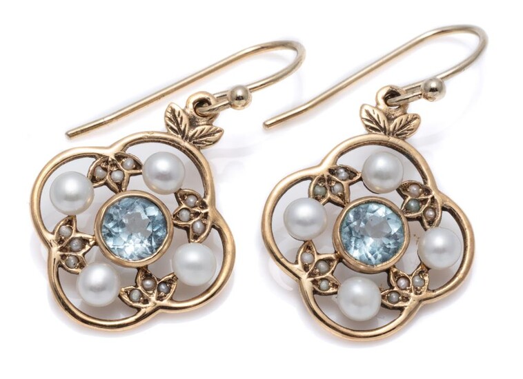 A PAIR OF EDWARDIAN STYLE TOPAZ AND PEARL EARRINGS; quatrefoil mounts each centring a round cut blue topaz surrounded by 3.5mm round...
