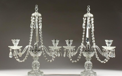A PAIR OF GLASS TWO BRANCH CANDLESTICKS, with prism