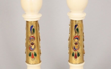 A PAIR OF IVORY AND GILT SILVER CANDLESTICKS