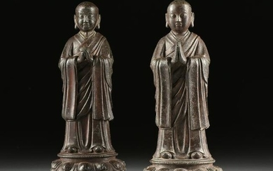A PAIR OF MING DYNASTY STYLE ENAMELED BRONZE DISCIPLES