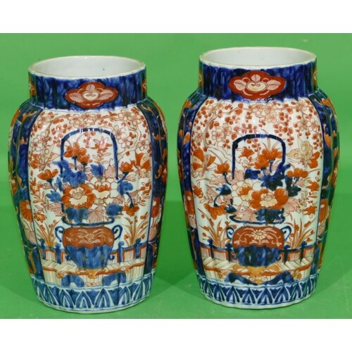A Pair of Imari Bulbous Thin Necked Reeded Vases on white, b...