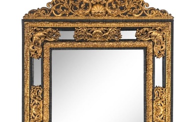 A Régence Style Gilt Pressed Metal and Ebonized Ripple-Molded Mirror