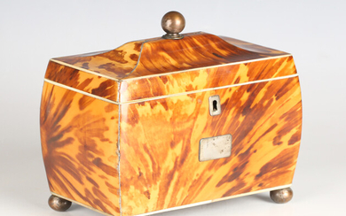 A Regency tortoiseshell tea caddy of sarcophagus form with ivory and white metal banding, raised on