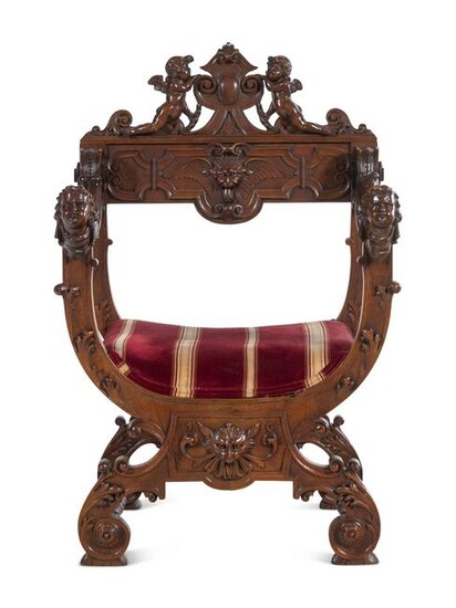 A Renaissance Revival Carved Walnut Savonarola Chair