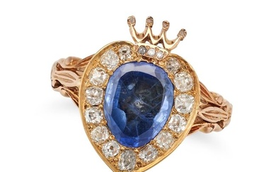 A SAPPHIRE AND DIAMOND SWEETHEART RING in yellow gold, set with an oval shaped sapphire in a cluster
