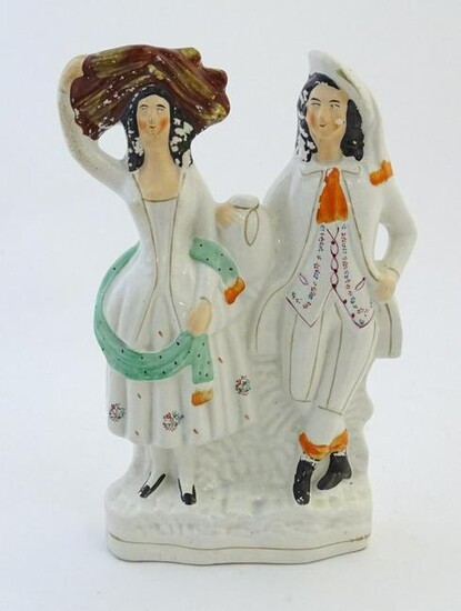 A Staffordshire pottery flat back figural group