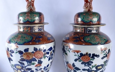 A VERY LARGE PAIR OF 19TH CENTURY JAPANESE MEIJI PERIOD IMARI COUNTRY HOUSE VASES AND COVERS painted