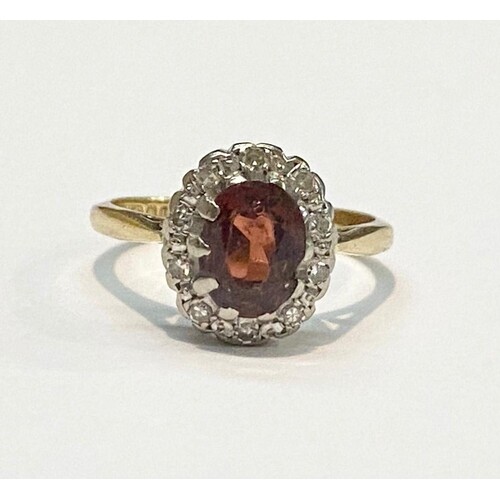 A VINTAGE 18CT GOLD GARNET AND DIAMOND CLUSTER RING, by Char...