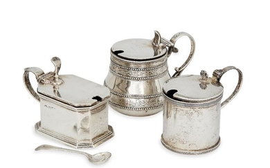 A Victorian silver mustard, London, c.1870, George Fox, of circular baluster form with floral and bead banding to body, together with a panelled rectangular mustard, Chester, c.1929, Adie Bros, and a cylindrical mustard (liner deficient)...
