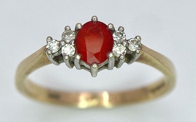 A Vintage 9K Yellow Gold, Red Sapphire and Diamond...