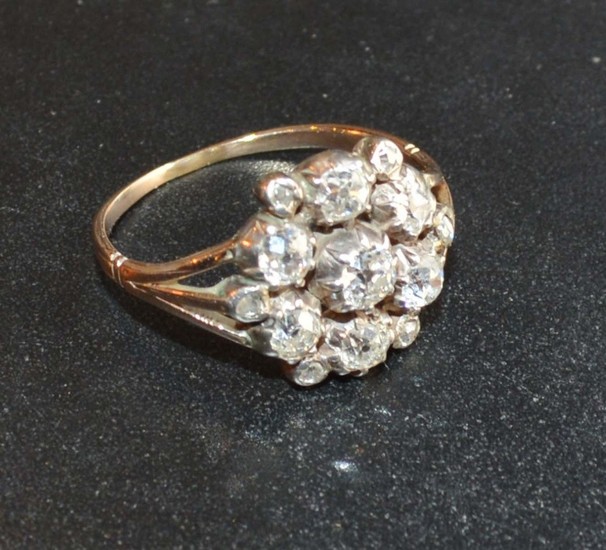 A Yellow Metal Diamond Cluster Ring with seven diamonds and ...