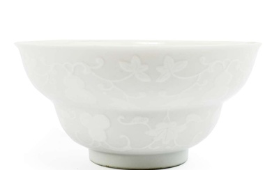 A blanc-de-chine bowl with gourds in relief