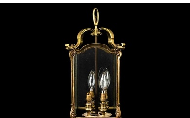A brass four light hall lantern. 20th century, fitted three ...