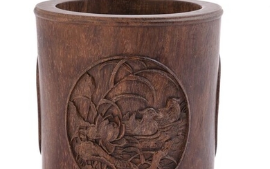 A carved hardwood brush pot