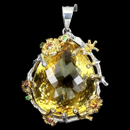 A citrine pendant set with a pear-shaped citrine and smaller circular-cut sapphires and tsavorite garnets, mounted in rhodium- and gold plated sterling silver.