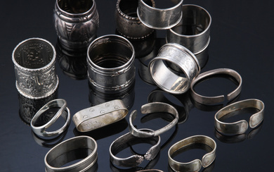 A collection of silver and sterling silver napkin rings (16)