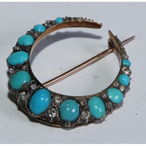 A diamond and turquoise crescent brooch, tapering body inset...