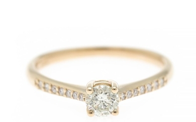 A diamond ring set with a brilliant-cut diamond flanked by numerous brilliant-cut diamonds weighing a total of app. 0.38 ct, mounted in 14k gold. Size 54.