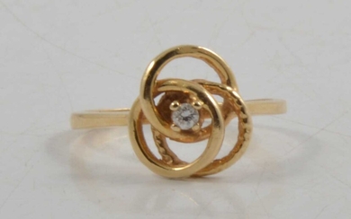 A diamond set knot design dress ring.