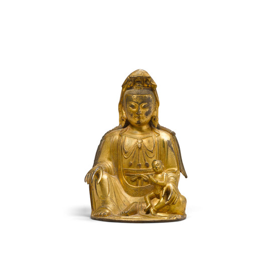 A gilt copper alloy seated figure of the Songzi Guanyin