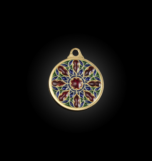 A gold and enamel pendant