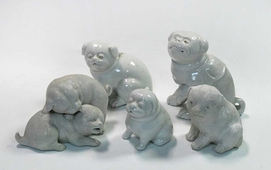 A group of five Japanese porcelain puppy and puppy groups, 19th/20th century