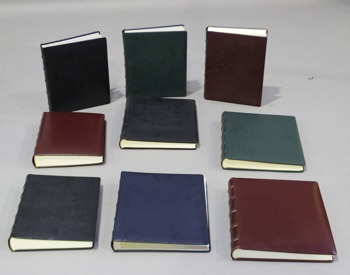 A group of nine modern Italian leather bound photograph albums, retailed by Harrods, some boxed.