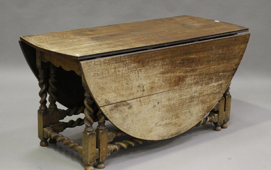 A large 18th century style oak oval gateleg table, raised on barley twist and block legs, height 70c