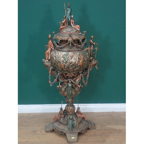 A large bronze effect Urn in the Roman style with figures of...