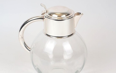 A large silver plate mounted glass water jug, the bulbous glass body to a rounded silver plated handle and collar, 26cm high