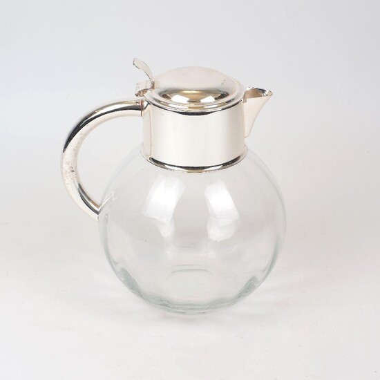 A large silver plate mounted glass water jug, the bulbous glass body to a rounded silver plated handle and collar, 26cm high