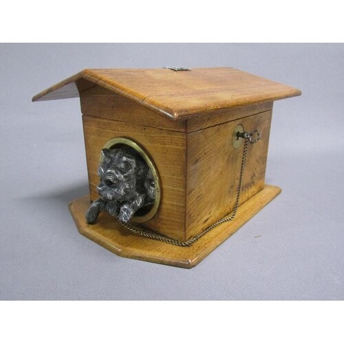 A late 19c/early 20c fruitwood dog kennel tea caddy with a s...