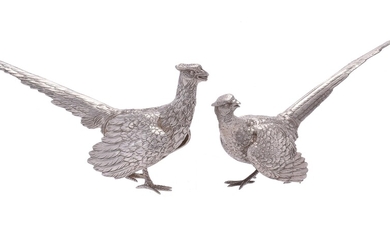A matched pair of silver models of pheasants