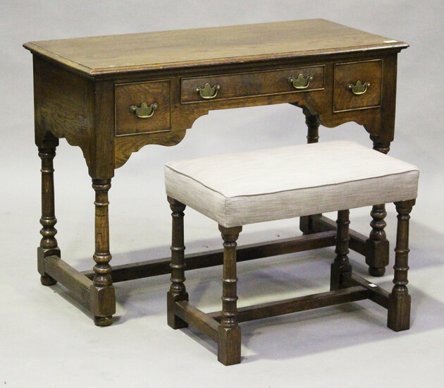 A modern 18th century style oak dressing table by Bylaw, height 76cm, width 106cm, depth 50cm, toget