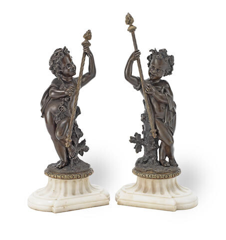 A pair of 19th century French patinated bronze figures of Bacchanalian putti
