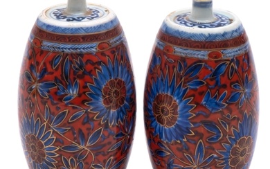 A pair of Chinese porcelain spirit bottles, of barrel shaped...
