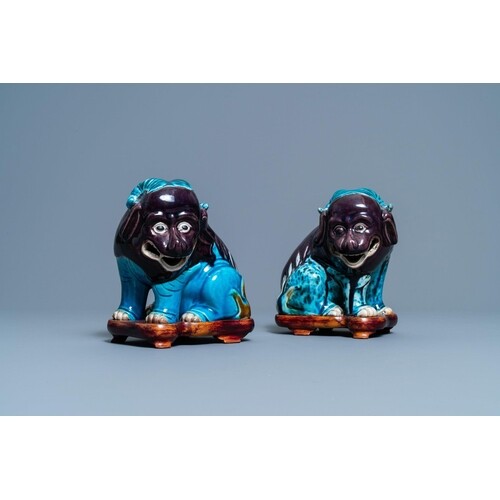 A pair of Chinese turquoise- and aubergine-glazed models of ...