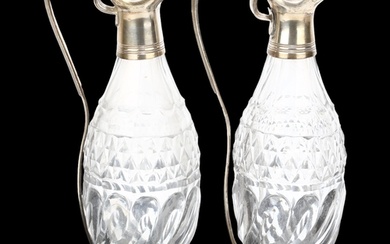 A pair of George III silver-mounted glass oil and vinegar cr...
