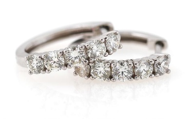 A pair of diamond ear pendants each set with five brilliant-cut diamonds...