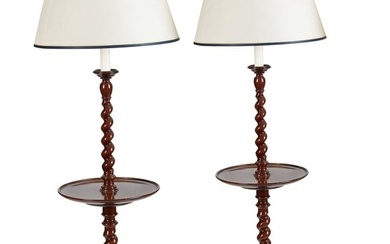 A pair of oak barley twist lamp tables