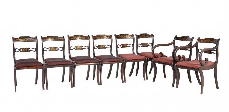 A set of eight Regency simulated rosewood and brass inlaid dining chairs