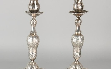 A set of silver candlesticks 800/000, rococo style.