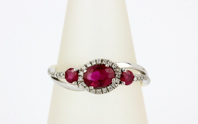 An 18ct gold and platinum ruby and diamond set ring, (O.5).