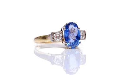 An 18ct hallmarked sapphire and diamond three stone ring, ce...