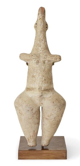 An Amlash-style steatopygous figure, Iran, standing naked with bulbous legs and buttocks, with stumpy arms outstretched and prominent breasts, the tall neck with tapering head, incised eyes and pinched nose, ears pierced for earrings (missing), Not...