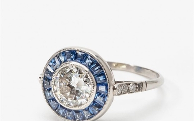 An Art Deco diamond and sapphire entourage ring...