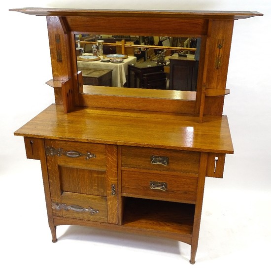 An Arts and Crafts golden oak mirror-back sideboard, circa 1...