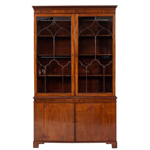 An Edwardian mahogany bookcase:, the upper part with a mould...