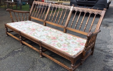 An Ercol elm Old Yorkshire pattern three-seater sofa with turned...