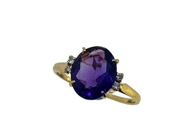 An amethyst and diamond ring, claw set oval faceted amethyst, approximately 10.9 x 8.85mm, estimated